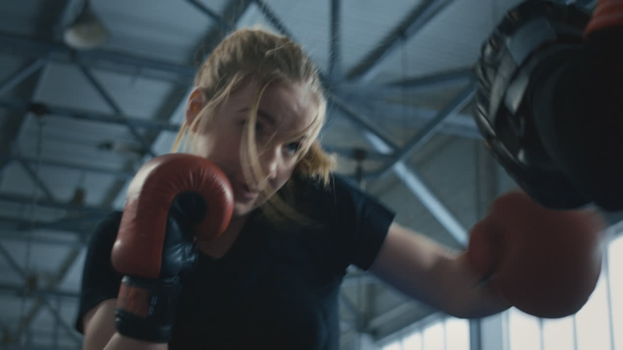 Woman practicing boxing or kickboxing