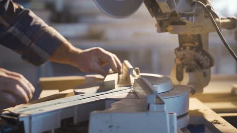 The-carpenter-cuts-wood-with-a-chainsaw.