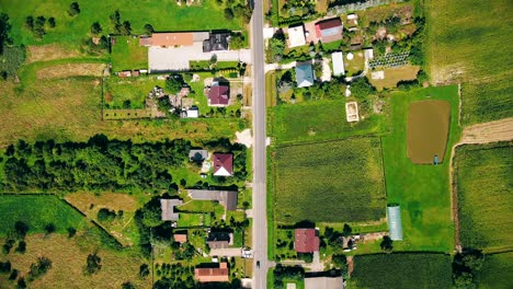 Aerial-view-of-green-fields-and-sun-in-the-sky