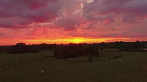 aerial drone forward moving shot over enjoying the red predawn twilight together on a tranquil river