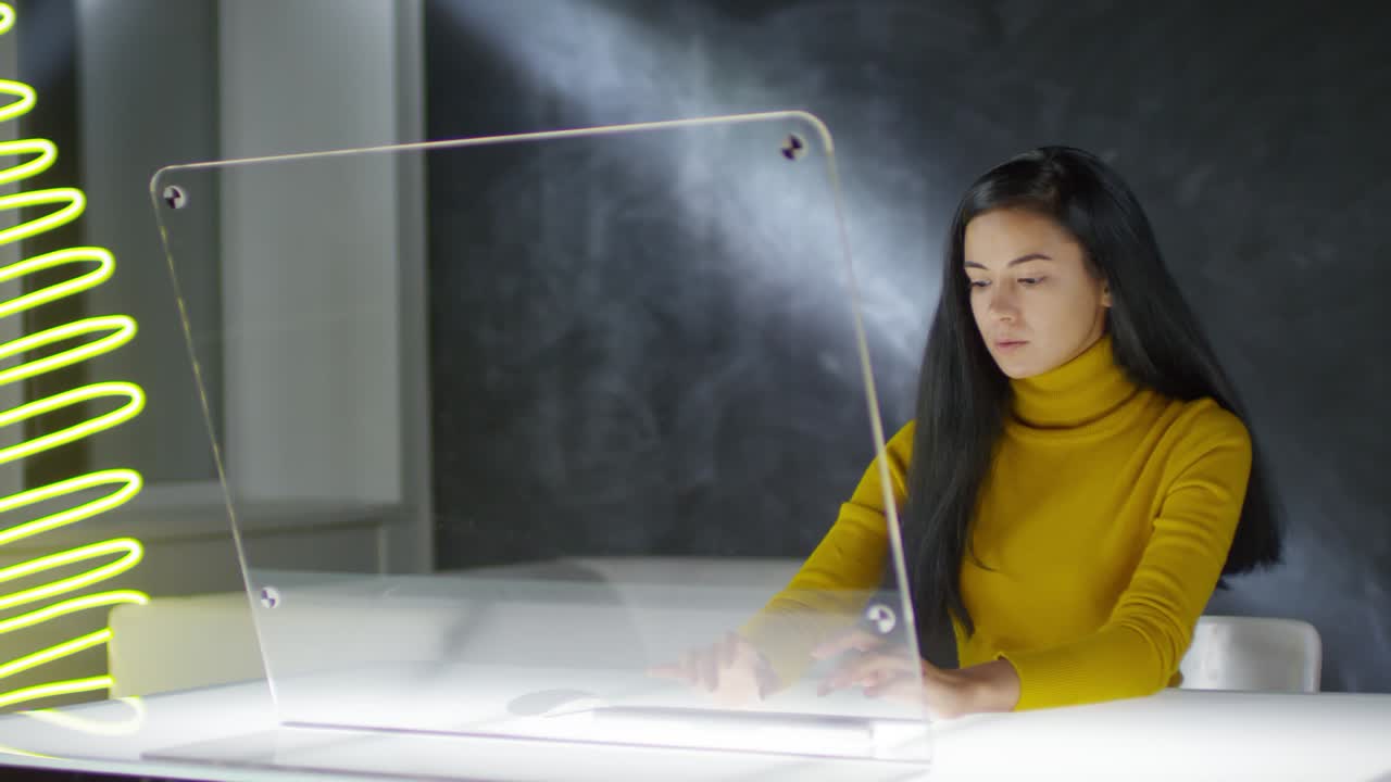 Young Woman Coding on Futuristic Computer