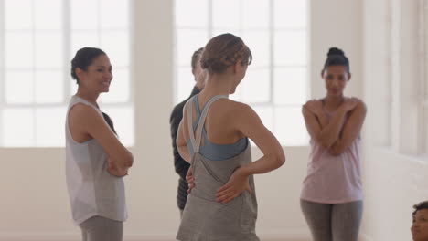 healthy group of women in yoga class enjoying conversation sharing lifestyle discussing fitness practice chatting in studio