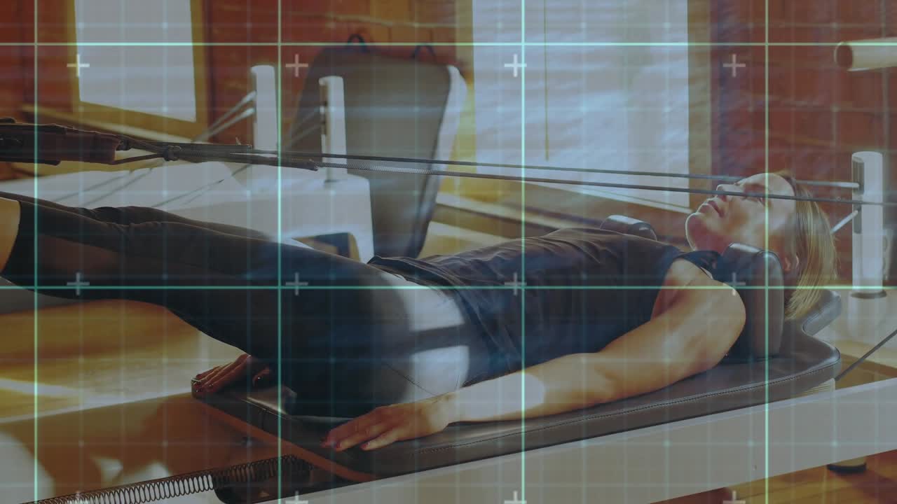 Woman on Pilates reformer starting repeated leg lifts for fitness, overlay tracking leg motion