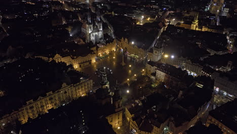 prague czechia aerial v88 birds eye view drone flyover and around famous old town square capturing cultural and historical architectural landmarks at night - shot with mavic 3 cine - november 2022