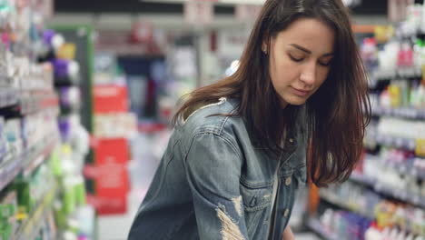 woman shopping for personal care products in a grocery store