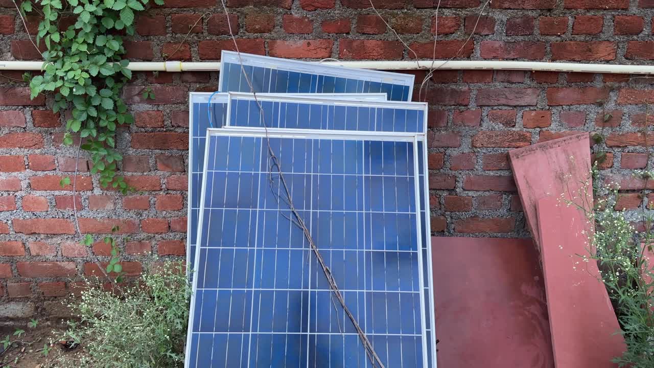 closeup of used solar panels revealing signs of weathering, potential damage, and degradation