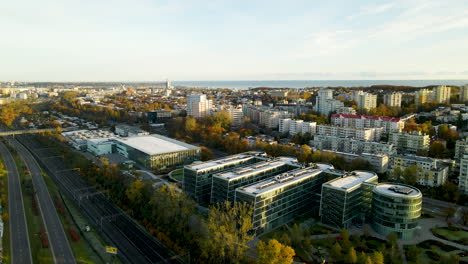 -Pomeranian-Science-and-Technology-Park-Gdynia---at-autumn-sunrise-with-city-panorama-on-background,-Polish-Innovation-development-hub