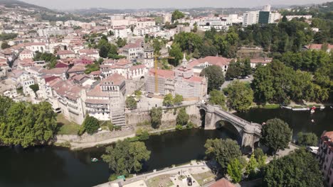 breathtaking aerial shot of riverside historical monastery of sao goncalo and bridge