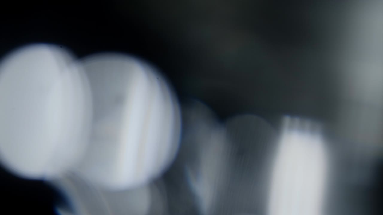 Abstract light leaks on black background.