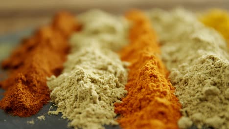 Various-type-of-spice-powder-on-tray-4k