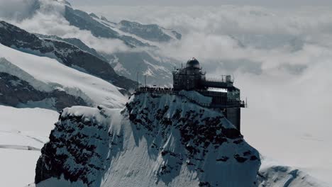circling shot of jungfraujoch and aletsch glacier with clouds