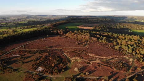 Beautiful-aerial-shot-panning-across-a-rural-countryside-landscape-in-England