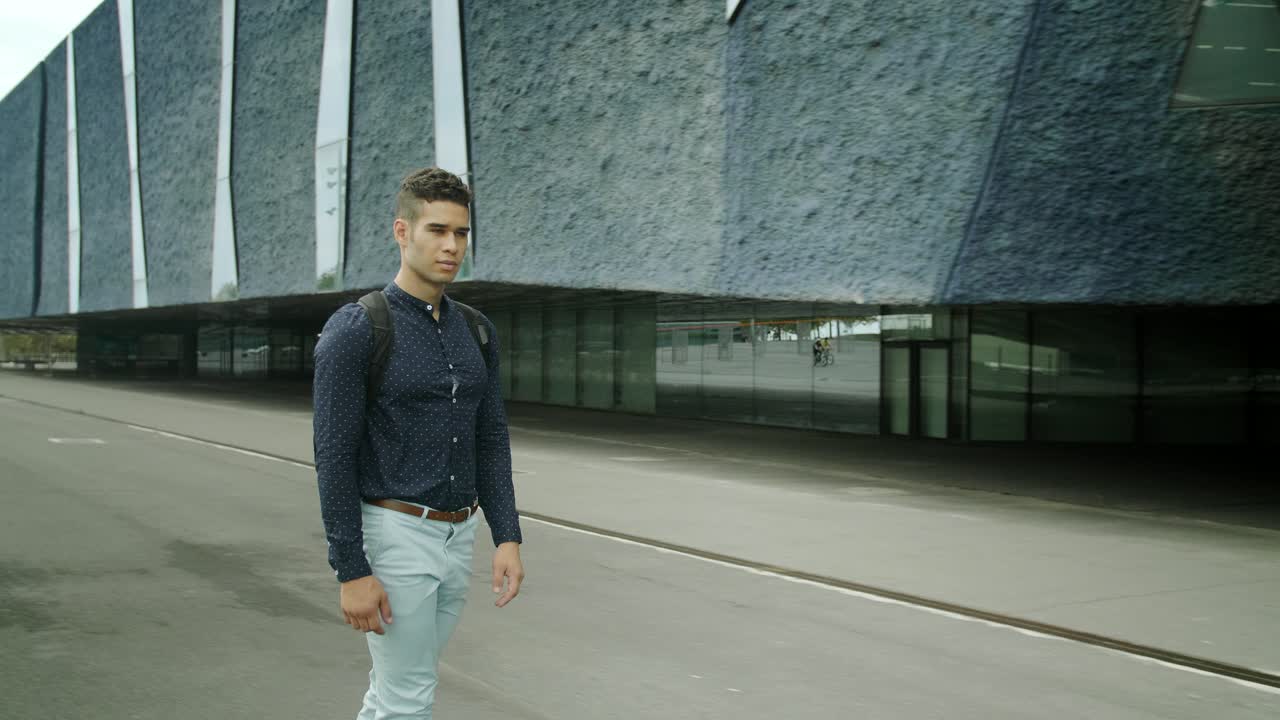 Well-Dressed Entrepreneur businessman Portrait of a Young Attractive Trendy Man skateboarding on a sunny morning day with a modern urban city background