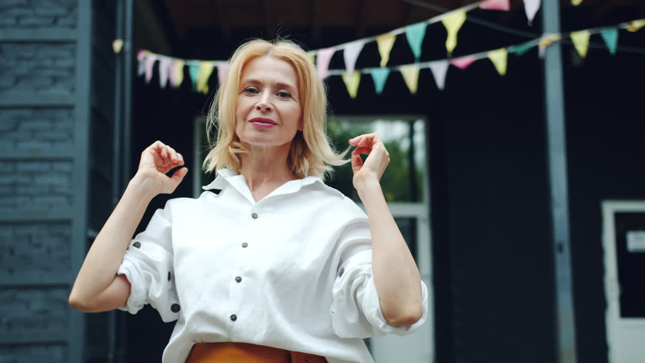 Woman in white shirt and orange skirt