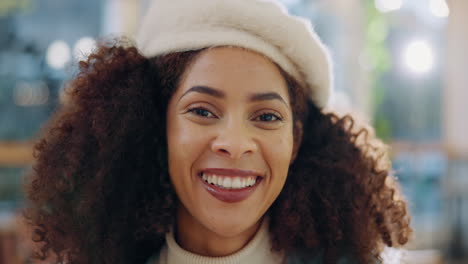 portrait of a smiling woman with curly hair