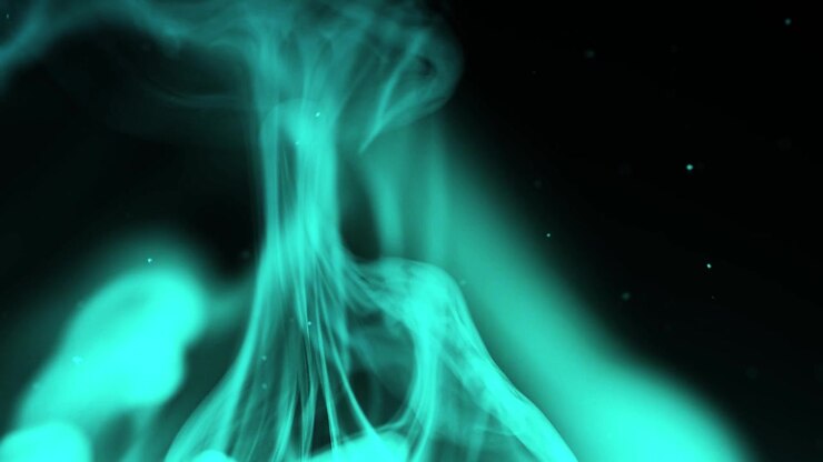 Elegant Wisps of Blue Smoke and Particles Against Black Background