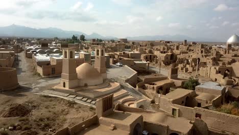 cloudy sky horizon landscape in a hazy day in desert water reservoir collect water from qanat underground system in a dome shape place with badgir wind catcher to ventilation and air flow in iran