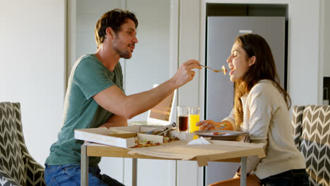 man feeding food to his woman 4k