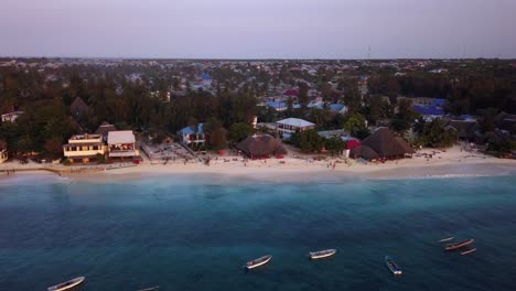 aerial view of a tropical beach town at sunset