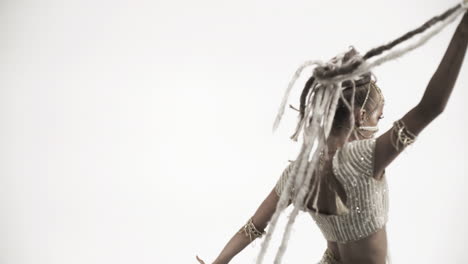 oriental beautiful girl dancing on a white background