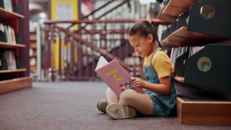 girl reading a book in the library