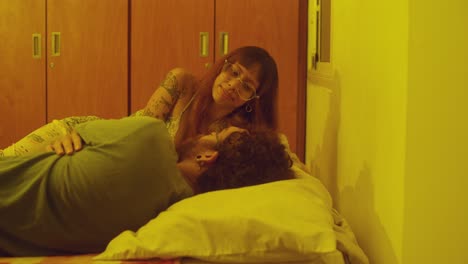 happy young couple talking in bed