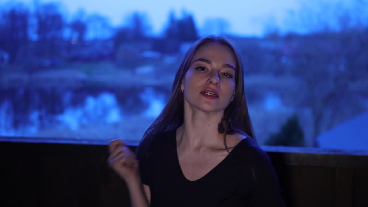 Stunning female Caucasian performer dancing and singing at night