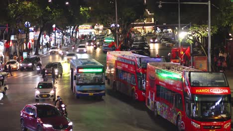 time-lapse of traffic and pedestrians at night