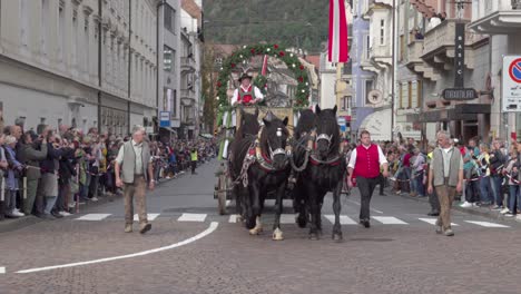 horse-drawn carriage of the forst brewery during the grape festival parade in meran - merano, south tyrol, italy (part 1 of 2)