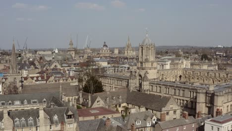 drone shot past christ church tom tower towards bodleian library radcliffe camera oxford