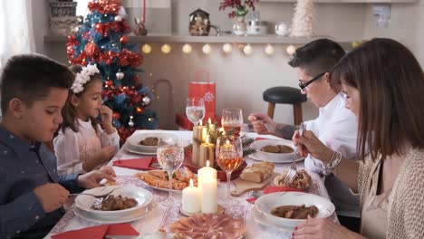 happy family eating during the christmas lunch