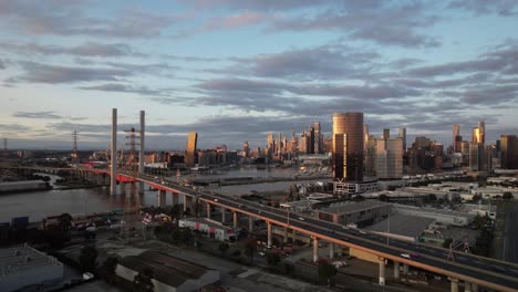 traffic on the bolte bridge aerial static sunset, melbourne skyline