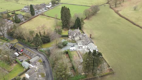 drone doing a semi-orbit of grasmere, a mountain village located in cumbria, at westmorland and furness in northwest england in united kingdom