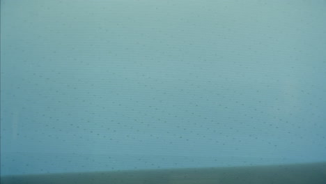 a retro tv displaying static noise, creating a nostalgic vintage atmosphere with blue and green hues.