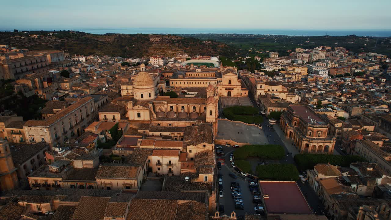 Noto historic center and San Nicolò Cathedral, warm tones highlight the elegant architecture. Aerial