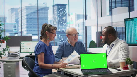 Financial-banker-works-with-a-copy-space-on-tablet-with-his-elderly-clients