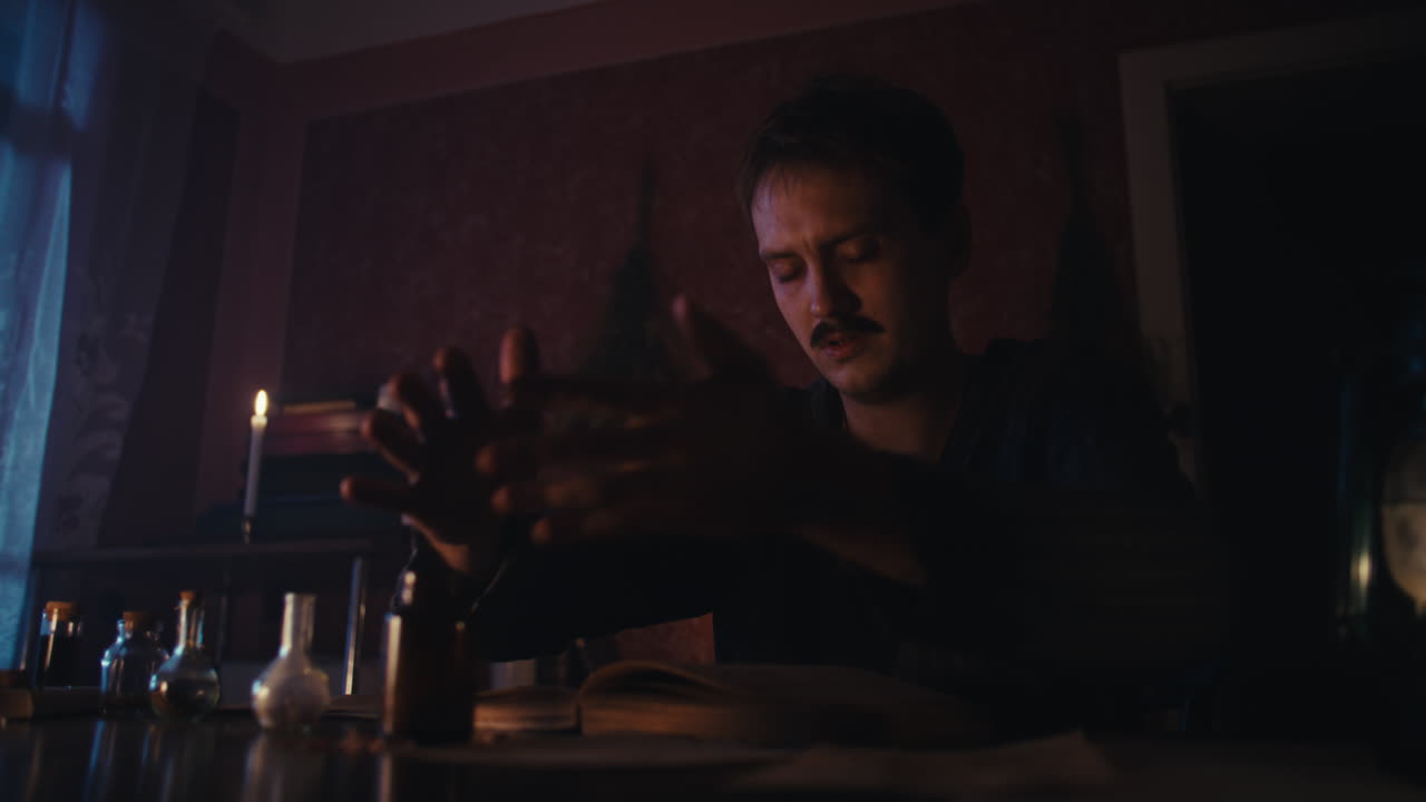 Alchemist Studying Ancient Texts and Potions in a Dim Room