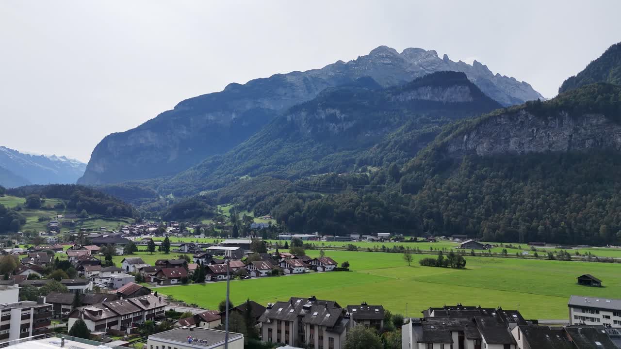 aerial landscape of the town of Meiringen, Switzerland and surrounding pastures