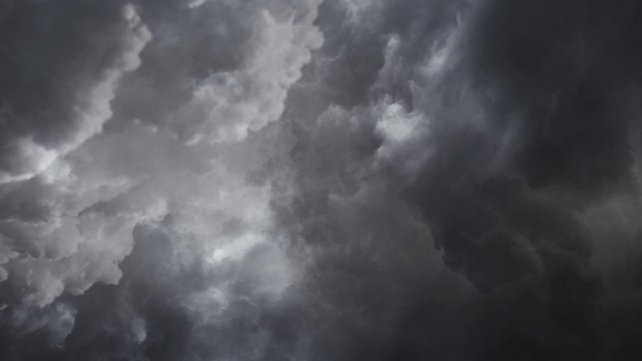 View of flying through dark  cumulonimbus clouds, thunderstorm