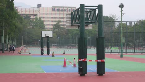 empty colorful basketball courts are seen at a closed playground due to covid-19 coronavirus outbreak and restrictions in hong kong