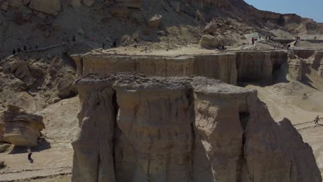 fly over a desert erosion landforms coastal desert climate iran hormuz island wonderful scenic landscape adventure hiking trip to summer hot climate countryside pillar rocky clay mud in valley canyon