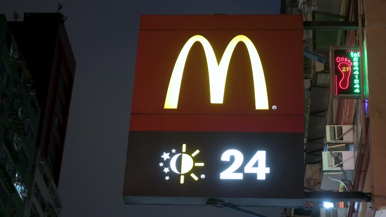 Illuminated McDonald's 24-Hour Sign at Night