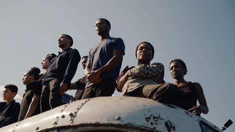 group of young adults on a metal structure