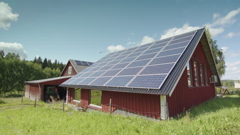 Barn-roof-covered-in-solar-panels,-green-energy-production,-copy-space