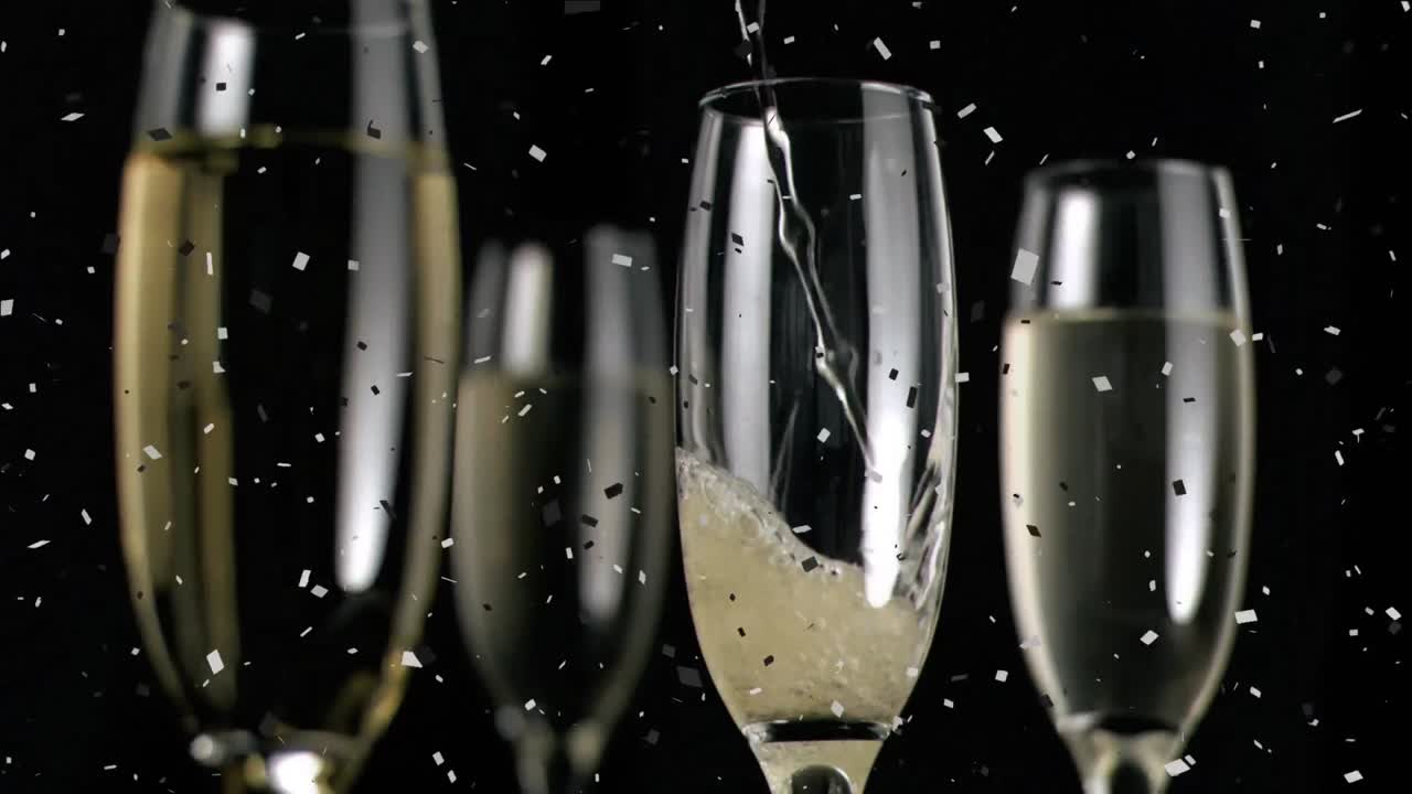 Animazione di bicchieri da champagne e champagne che viene versato, con coriandoli che cadono su sfondo nero