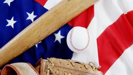 Baseball,-baseball-bat-and--baseball-gloves-on-an-American-flag