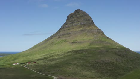 grand kirkjufell mountain illuminated by beautiful sunlight in iceland