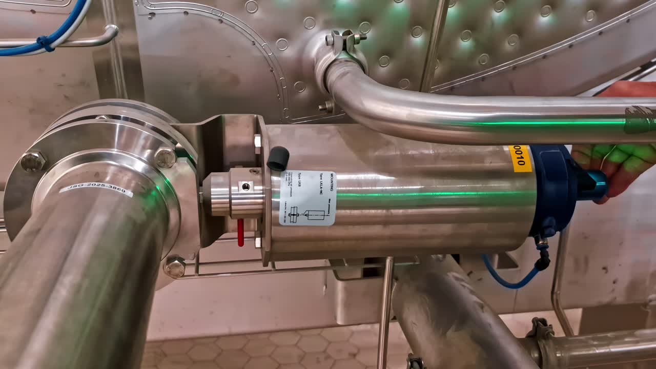 Metal tubes and mechanical fittings in industrial facility, clean and organized system view