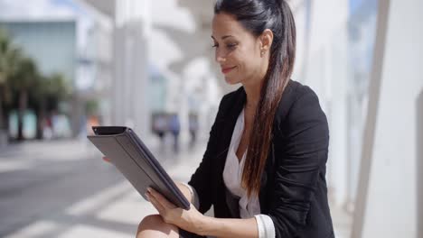 attractive businesswoman working on a tablet