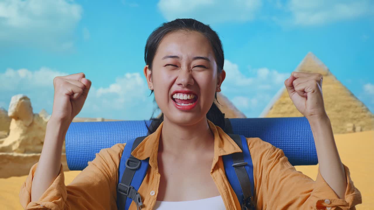 Close Up Of Asian Female Hiker With Mountaineering Backpack Screaming Goal Celebrating The Success While Traveling In Pyramid Of Giza